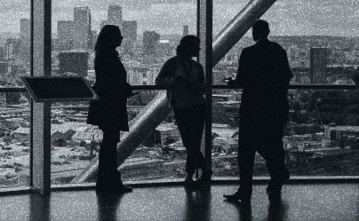 three people standing by a window